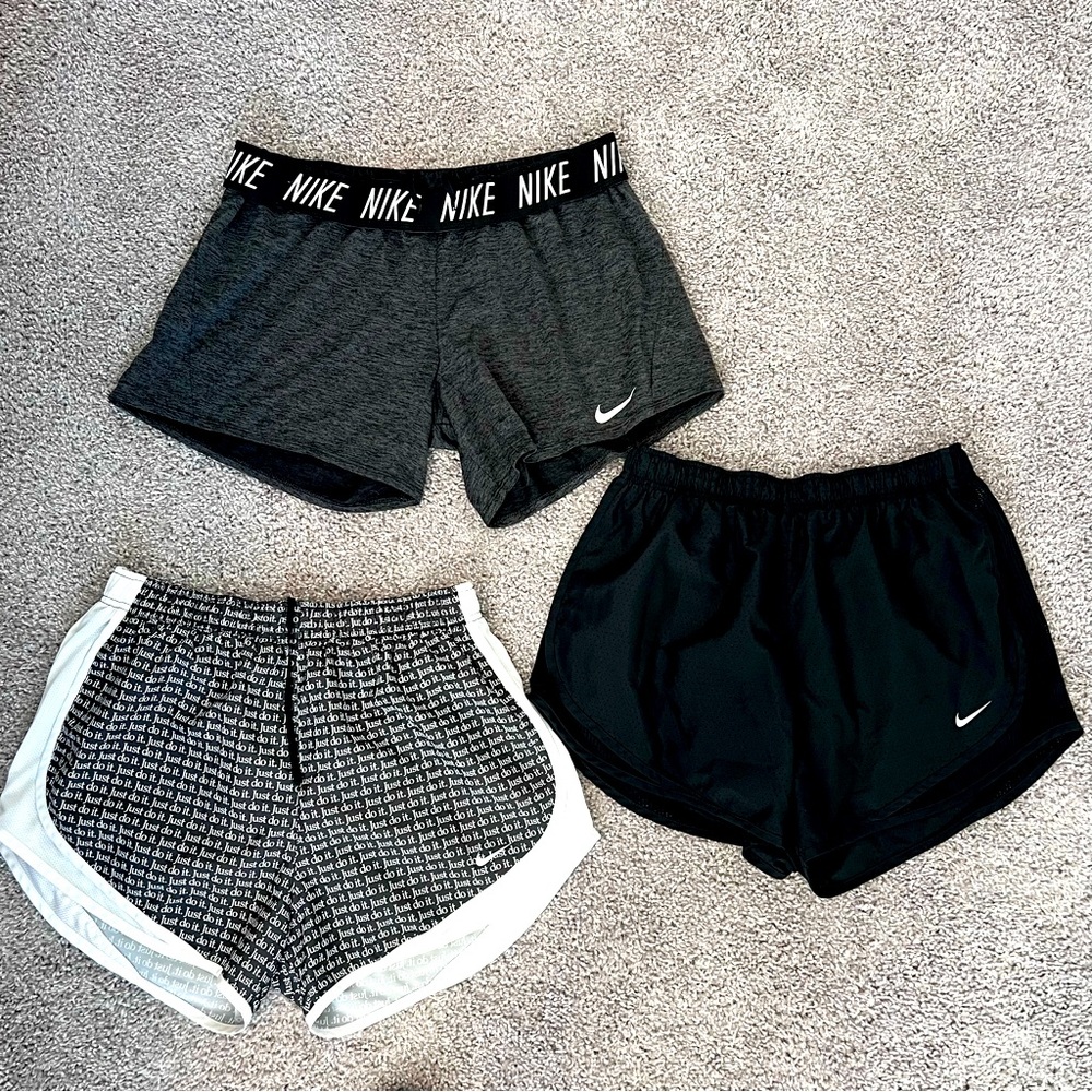 Three pairs of size large Nike activity shorts